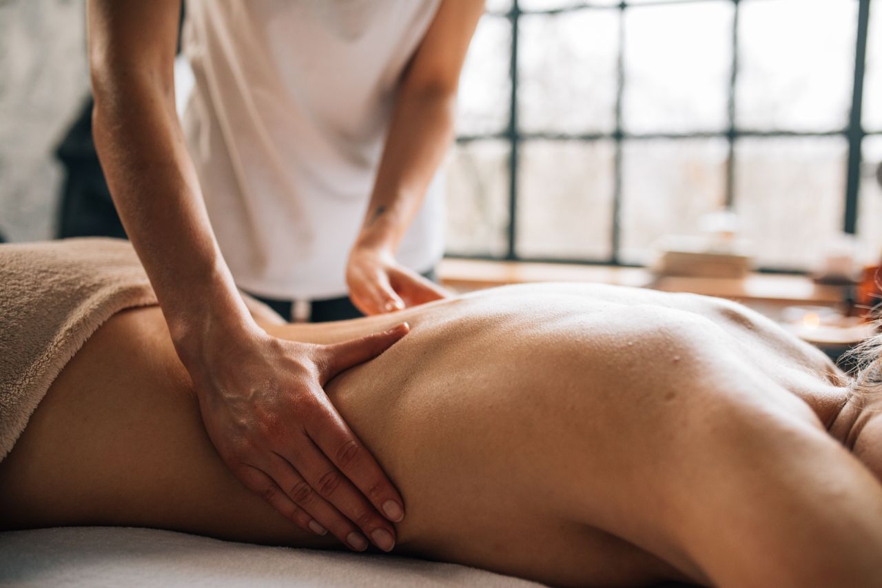 services-01 Experience relaxation with a full body massage in a serene indoor spa environment.
